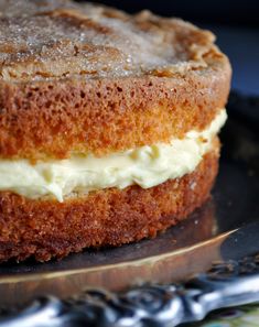 a close up of a cake on a plate with the words, olive oil cakes with lemon mascarpone cream