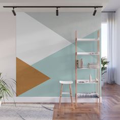 a living room with an abstract wall mural