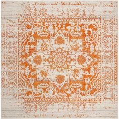 an orange and white rug with intricate designs on the top, in front of a white background