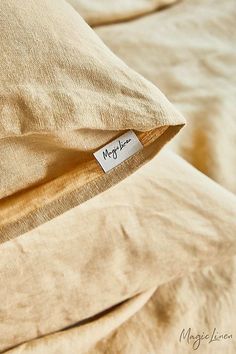 a pillow with a tag on it that says me and i love you next to the pillows