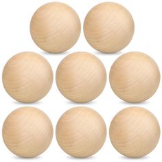 six wooden balls arranged in a pyramid on a white background