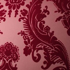 red and white wallpaper with an ornate design on the bottom half of each piece