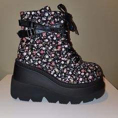 Demonia Floral Kera Boots Never Worn Women's Size 10 Very Cute Straps And Details. If You Have Any Questions, Please Feel Free To Ask. Item Will Be Mailed In Original Box. All Sales Are Final. Check Out My Closet For Similar Items! Spring Streetwear Boots With Reinforced Heel, Alternative Style Synthetic Boots For Concerts, Spring Concert Lace-up Boots, Alternative Synthetic Boots For Concerts, Platform Boots For Spring Streetwear, Black Synthetic Alternative Style Boots, Alternative High-top Synthetic Boots, Spring Synthetic Platform Wedge Boots, Lace-up Synthetic Wedge Boots For Spring