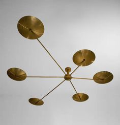 a brass chandelier with eight lights hanging from it