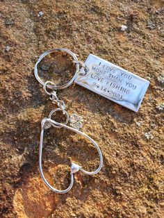 a keychain that says i love you more than you live fishing on it