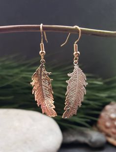 Gold Feather Earrings. Handmade using alloy metal filigree etched feather shaped pendants placed on stainless steel golden coloured hook back ear wire or round golden round lever back Earrings, please chose in options before checkout. The feather pendants are 3.5 cm in length and 1.5 cm in width.  These beautiful boho golden feather Earrings are a perfect gift for her, mum, daughter, girlfriend, wife and every day accessory. The feather pendants have a detailed design and wonderful spiritual ang Gold Feather Earrings As A Gift, Gold Feather Earrings For Gift, Adjustable Gold Feather Earrings, Dangle Feather Jewelry As A Gift, Feathered Dangle Jewelry As A Gift, Earrings With Price, Golden Feather, Gold Feather Earrings, Gold Feathers