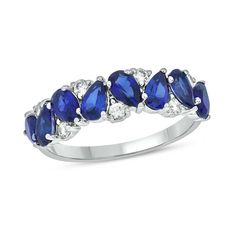 a white gold ring with blue stones and diamonds