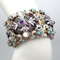 Antique Czech 800 silver wide ornate panel bracelet, partially gilt, featuring intricate patterns, decorated with gemstone cabochons and enamel. This spectacular bracelet is 7 1/4" long, 1 3/4" wide, weighing 143.1 grams or 4.61 ozs Troy. EA5118 Ornate Jeweled Ceremonial Jewelry, Ornate Multi-stone Jewelry For Ceremonial Occasions, Luxury Silver Bracelets With Cabochon, Silver Cabochon Bracelet For Wedding, Wedding Silver Bracelet With Cabochon, Ornate Multi-stone Collectible Jewelry, Ornate Jeweled Bracelets For Formal Occasions, Ornate Cabochon Bracelet Jewelry, Ornate Cabochon Bracelet