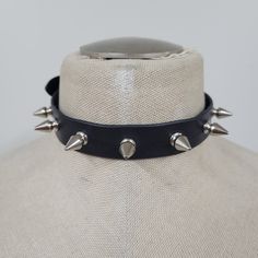 Handmade leather choker adjustable from 13 inches up to 16 inches. (13", 13 1/2", 14", 14 1/2", 15", 15 1/2", 16") leather is ~ 1.8 to 2.2 MM thick choker contains 7 spikes (0.5 inch in lenght) Spike Collar Drawing, Punk Style Spiked Choker Jewelry, Punk Style Spiked Choker, Punk Choker With Spikes, Concert Choker With Spikes, Spiked Choker For Concert, Spiked Choker For Concerts, Gothic Spiked Choker For Festivals, Edgy Spiked Choker For Party