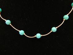 "Turquoise 14k Yellow Gold Necklace Measures 16.5 Inches Long or 42 cm 18 round turquoise beads measuring approximately 6 mm each Total weight: 6.2 Grams 082212-198V FEEL FREE TO MESSAGE ME WITH A BEST OFFER OR IF YOU WISH TO SEE MORE PICTURES! Save money! We combine shipping where you pay only $1.00 more for any additional items on the same order! * Back to Shop Watch and Wares? https://www.etsy.com/shop/watchandwares * Ready to purchase? Click the green button \"Add to cart\" * Have a question Elegant Turquoise Necklace With Gemstone Beads, Elegant Turquoise Gemstone Bead Necklace, Elegant Turquoise Necklace With Round Beads, Elegant Blue Turquoise Necklace With Round Beads, Elegant Turquoise Necklace With Round Beads For Jewelry Making, Elegant Single Strand Turquoise Necklace, Elegant Turquoise Single Strand Necklace, Elegant Turquoise Necklace With Polished Beads, Elegant Single Strand Turquoise Jewelry