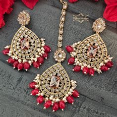 "Handcrafted gold & red polki earrings & tikka set! The earrings are approximately 3 \" long & 2.25 \" wide. Pictures are taken in room light indoors. Please contact if you have any questions. Thanks!" Red Kundan Tikka For Navratri, Red Stone Work Jewelry For Eid, Red Jewelry With Stone Work For Eid, Festive Bollywood Ruby Chandbalis, Bollywood Style Ruby Chandbalis For Festive Occasions, Bollywood Ruby Danglers For Festive Occasions, Red Jewelry For Eid Celebration, Red Tikka For Navratri, Red Ruby Chandbalis For Diwali