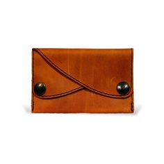 The perfect purse, wallet for the minimalist person. Two compartments closed with snap fasteners make it possible to sort money and cards. Made from fine, robust cowhide leather. The classic design is practical and fits any everyday style. Brown Waxed Finish Wallets For Everyday Carry, Brown Leather Trifold Wallet With Waxed Finish, Brown Rectangular Wallet With Waxed Finish, Everyday Brown Coin Purse With Card Slots, Minimalist Leather Trifold Wallet, Brown Trifold Wallet With Coin Pocket For Everyday, Cognac Trifold Wallet With Card Slots For Everyday Use, Brown Rectangular Trifold Wallet With Waxed Finish, Brown Waxed Finish Trifold Wallet