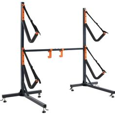 two black and orange gym equipment stands on wheels with one standing up against the other