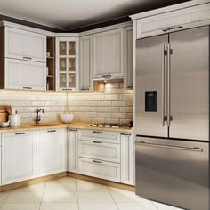 a kitchen with white cabinets and stainless steel appliances