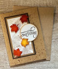 a close up of a greeting card with autumn leaves on the front and back of it