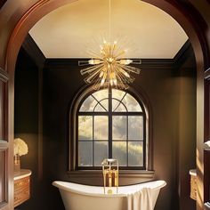 a bathroom with a claw foot bathtub and chandelier in it's center