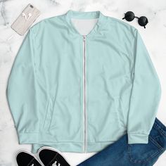 Add a little zing to your wardrobe with this vibrant light cyan blue Bomber Jacket.  Wear it on a basic t-shirt, or layer it on top of a warm hoodie--it'll look great either way.  With a brushed fleece inside, and a relaxed unisex fit, this Bomber Jacket is just the stuff of the dreams, so be quick to grab yourself one! * 100% polyester * Fabric weight: 6.49 oz/yd² (220 g/m weight may vary by 5% * Brushed fleece fabric inside * Unisex fit * Overlock seams * Sturdy neck tape * Silver YKK zipper * Spring Athleisure Outerwear With Crew Neck, Sporty Light Blue Cotton Outerwear, Blue Relaxed Fit Athleisure Outerwear, Light Blue Fitted Casual Outerwear, Light Blue Athleisure Top For Streetwear, Solid Crew Neck Outerwear For Athleisure, Sporty Light Blue Outerwear For Streetwear, Light Blue Crew Neck Casual Outerwear, Sporty Blue Relaxed Fit Outerwear