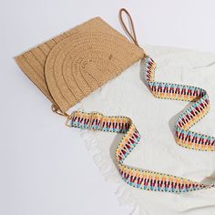 Embrace Boho Chic Style Elevate your summer wardrobe with the Women's Bohemian Straw Clutch Handbag, a perfect blend of style and functionality. This hand-woven rattan straw clutch is designed to bring out your inner bohemian spirit while keeping your essentials secure. Ideal for beach outings, casual gatherings, or even an evening stroll, this versatile purse will quickly become your go-to accessory for the season. Product Features Material: Made from high-quality straw for a natural and eco-friendly look. Design: Hand-woven with intricate detailing, giving each bag a unique, artisanal touch. Shape: Frame design that offers ample space without compromising style. Straps: Single, durable shoulder strap for comfortable carrying. Closure: Secure hasp closure to keep your belongings safe. Lin Straw Pouch Bag With Adjustable Strap For Vacation, Vacation Straw Pouch Bag With Adjustable Strap, Summer Straw Pouch Bag With Adjustable Strap, Casual Summer Straw Pouch Bag, Casual Summer Pouch Straw Bag, Beige Straw Pouch Bag For Beach, Beige Pouch Straw Bag For Beach, Beach Season Straw Pouch Bag With Adjustable Strap, Beige Pouch Straw Bag For The Beach