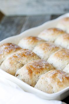 freshly baked rolls in a white baking dish