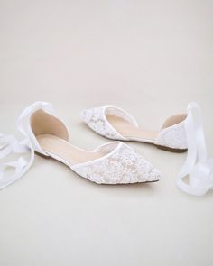 Crochet lace pointy toe flats for comfortable wear throughout your special day and perfect for wedding party. We've added satin or sheer organza lace up ribbon to make this a ballerina shoe. DETAILS: UPPER: Synthetic upper and lining MATERIALS: Manmade outsole HEEL HEIGHT: 0.3" ORIGIN: Imported Spring Wedding Pointed Toe Flats, Spring Lace Flat Heel Wedding Shoes, Lace Flat Heel Wedding Shoes For Spring, Low Heel Wedding Flats For Spring, Spring Wedding Flats With Flat Heel, Spring Wedding Pointed Toe Closed Flats, Spring Wedding Flats With Low Heel, Lace Wedding Shoes With Flat Heel For Spring, Spring Wedding Lace Shoes With Flat Heel