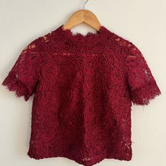 Elegant Eyelet Style Top In Maroon Color That You Can Wear Up Or Down Fitted Red Tops With Lace Trim, Fitted Red Top With Lace Trim, Floral Embroidery Lace Top With Short Sleeves, Red Lace Trim Tops For Spring, Red Lace Tops For Spring, Festive Red Short Sleeve Tops, Zara Floral Embroidered Party Top, Red Lace Tops For Summer, Red Fitted Crochet Lace Top