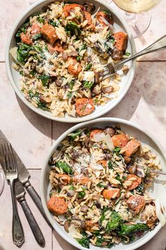 two white bowls filled with pasta and vegetables