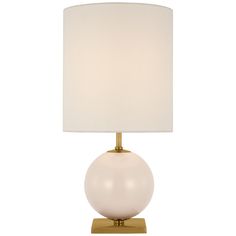 a table lamp with a white shade on the base and a light bulb attached to it