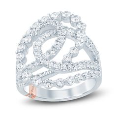 a white gold ring with diamonds on the sides and an openwork design in the middle