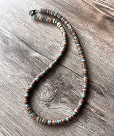 A lightweight beaded mens necklace made with coconut wood and turquoise magnesite beads. The matching bracelet is also available but is sold separately. - Necklace measures 20.5" (more lengths are listed)- Wood beads measure approximately 8 - 9mm- Gunmetal lobster claw clasp (gunmetal toggle, stainless steel lobster, stainless toggle, magnetic ball clasp are also available) The length may vary slightly due to the clasp chosen. The mannequin's neck size is 14.5". In order to determine the correct Coconut Wood, Surfer Necklace, Mens Necklace, Brown Kraft Paper, Paper Jewelry, Matching Bracelet, Men's Necklace, Brown Kraft, Matching Bracelets