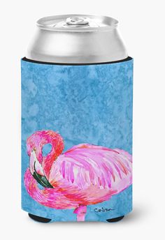 a pink flamingo can cooler on a blue background