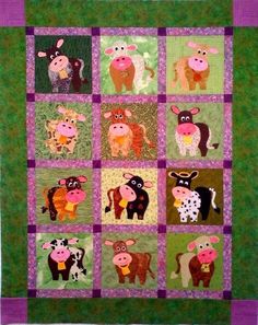 a quilted wall hanging with farm animals on it's sides and purple trim around the edges