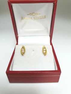 22ct Yellow Gold Two Stone Cubic Zirconia Earrings Claw Set  Metal : 22k Gold 916  Gwt : 1.32 grams    Packaging : Elegant Box  Shipping Free in UK Shipping World Wide : See Policy Payment : PayPal, Credit Card, Bank Transfer Returns Policy : 14 Days Hassle Free Returns for 100% Refund  You can also wear this as Nose stud. To try this item Or View More from our collections  Please Visit Our North West London Showroom Oval Gold Diamond Earrings, Classic Marquise Diamond Earrings In Gold, Gold Oval Diamond Earrings, Diamond Earrings With Diamond Eyes For Weddings, Formal Diamond Earrings With Diamond Eyes, Gold Oval Hallmarked Diamond Earrings, Gold Hallmarked Diamond Earrings For Anniversary, Gold Oval Diamond Earrings, Hallmarked, Classic Diamond Earrings With Diamond Eyes For Formal Occasions