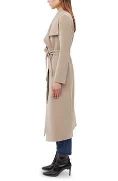 A supple, double-faced wool from Italy lends a soft and cozy feel to a timeless wrap coat. A face-framing, oversized collar tops the elegant midi-length style. 48 1/2" length (size Medium). True-wrap style. Oversized wing collar. Long sleeves. Removable tie belt. 100% wool. Dry clean. By Mackage; imported. Studio 121. Elegant Long Solid Color Sweater Coat, Elegant Long Sweater Coat, Elegant Sweater Coat With Shawl Collar For Work, Elegant Long Sweater Coat For Formal Occasions, Chic Wool Coat With Shawl Collar, Chic Shawl Collar Wool Coat For Fall, Elegant Lapel Collar Sweater Coat For Fall, Elegant Structured Beige Wool Coat, Elegant Wool Coat With Shawl Collar And Belt