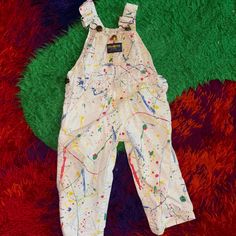 vintage oshkosh b gosh paint splatter pattern coveralls size  2T  made in  usa vestbak great condition, no areas of stain or damage Paint Splatter Overalls, Painted Overalls, Doctor Halloween Costume, Disney Costume, Vintage Oshkosh, Overalls Vintage, Kids Overalls, Disney Costumes, Bib Overalls