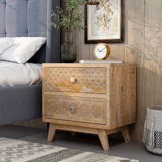 a bedroom scene with focus on the bed and bedside table that has a clock on it