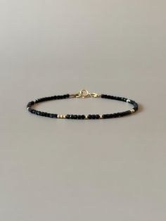 Fall in love with this so dainty black tourmaline bracelet - a perfect piece that features a timeless minimalist design mixed with a boho-chic aesthetic. Made of high-quality genuine  2.2mm black tourmaline cube gemstone beads with randomly scattered 14k gold filled or sterling silver accent beads. It is perfect for stacking or wearing alone and will complement but not overpower any outfit.  Gift-ready in a beautiful branded suede storage bag, perfect birthday, engagement anniversary or wedding Black Tourmaline Bracelet, Bracelets Handmade Diy, Boho Minimalist, Tourmaline Bracelet, Jewelry Minimalist, Bracelet Dainty, Tourmaline Jewelry, Birthstone Bracelets, Minimalist Bracelet