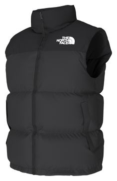 A retro North Face vest based on a baffle-quilted, down-insulated design from 1996 offers unmatched warmth right at the core. The durable ripstop shell with double-layer taffeta at the shoulders is perfect for backpacking, thanks to its packable design that can be stowed in its own pocket. 26 1/2" length (size Medium) Front two-way zip closure Stowaway hood Sleeveless Front zip pockets; interior zip pocket Lined with 700-fill power goose down 40D 54 g/m² 100% nylon ripstop with durable water-rep Functional Puffer Vest For Streetwear, Nylon Vest With Padded Collar For Streetwear, Sporty Puffer Vest For Outdoor Activities, Outdoor Nylon Vest With Padded Collar, Outdoor Puffer Vest With Down Filling, Outdoor Puffer Vest, Nylon Vest With Padded Collar For Outdoor, Outdoor Down Puffer Vest, Outdoor Puffer Vest Made Of Down