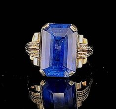 Gorgeous Vintage art deco filigree 18k white rose gold engagement ring blue sapphire in emerald shape circ 1920's center natural sapphire weight 9.86ct. GIA cert laboratory ,Size 14.1x9.2mm very nice quality sapphire,Very nice rich medium blue color ,clean , very lively.the setting is gorgeously and tremendously old ring in excellent condition. ring size 8 Resizable Retail value $18,500 net. Appraisal available Emerald Cut Sapphire Jewelry With Rose Cut Diamonds, Art Deco Sapphire Ring With Prong Setting, Formal Octagon Sapphire Ring In 14k Gold, Formal 14k Gold Octagon Sapphire Ring, Art Deco Blue Rings With Rose Cut Diamonds, Art Deco Blue Rose Cut Diamond Rings, Art Deco Sapphire Jewelry With 17 Jewels, Sapphire Art Deco Jewelry With 17 Jewels, Blue Sapphire Ring With Rose Cut Diamonds, Emerald Cut