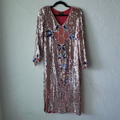 Spectacular Vintage Fully Sequined Kaftan Style Dress. Red Semi Sheer Fabric Completely Covered With Sequins And Pearl Details. Large, Intricate Floral Sequin And Pearl And Netting Design On Front And Matching On Back. Also On Sleeves At Hem. Right Sleeve Is Bunched At Netting And Pearls (See Photo). A Few Pearls Missing On Back Of Neckline, And Small Stain Inside. Shoulder Pads. Side Seam Slits At Bottom. Pearls Run Down All Seams And Hems. I Don't See Any Missing Sequins. This Is Amazing, Rare Kaftan Style Dresses, Kaftan Style, Pearl Details, Sheer Fabric, Sheer Fabrics, Dress Red, Dog Friendly, Style Dress, Size Tag