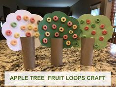 four apples trees made out of toilet paper with the words apple tree fruit loops craft