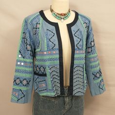 Well Decorated Cotton Jacket, Mid Blue With Green Trim, Copper, Silver Beaded, Stitch Work. Made In India. Label Is Simply Styled - Sears. Nineties. Condition Excellent, No Issues, Never Worn And Well Stored. Marked Size M, Shown On A 6 Mannequin. Length 20", Pit To Pit 20", Sleeves 20". Lined. Pockets. No Front Closure. Deadstock Vintage Blue Fall Festival Outerwear, Fall Bohemian Beaded Outerwear, Bohemian Beaded Outerwear For Fall, Bohemian Beaded Fall Outerwear, Casual Embellished Blue Outerwear, Casual Blue Embellished Outerwear, Fall Bohemian Embellished Outerwear, Casual Blue Outerwear For Festival, Bohemian Embellished Outerwear For Fall