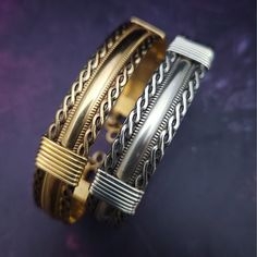 Bold, dramatic and luxurious, this traditionally styled bracelet is from our BABYLON COLLECTION. Babylonian jewelry was not only a way to add style but also represented wealth, status, and spiritual reverence. An exquisite craft, attention to detail, and artistic prowess left a permanent impression in the world of ancient jewelry. This bracelet features a smooth, domed center edged with a rope pattern and embraced with precious metal accents. A bit of chain in the back of the collars creates a soft, comfortable fit and keeps the collars moving fluidly as you move. THIS IS A LIMITED-RELEASE COLLECTION This collection will only be available thru July 2023, then the collection will be retired and removed from our shop. It might be reintroduced at a later date, but it may not. MATERIALS: Sterl Babylonian Jewelry, Rope Pattern, Wedding Jewelry Bracelets, Ancient Jewelry, Metal Accents, Precious Metal, Metallic Accents, Jewelry Care, Precious Metals