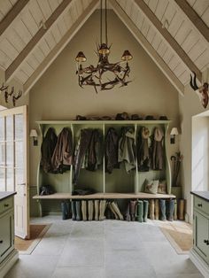 a room filled with lots of coats and shoes