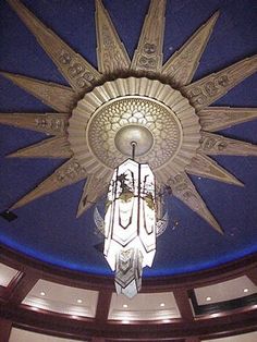 a chandelier hanging from the ceiling in a building