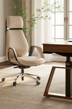 an office chair sitting in front of a desk with a potted plant on it