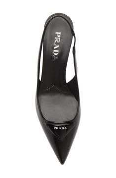 A pointy toe and sculptural kitten heel frame this slingback pump crafted of patent calfskin and finished with a puffy take on Prada's iconic triangle logo. 2" (55mm) heel Elasticized slingback strap Leather upper and lining/leather and rubber sole Imported Designer Shoes