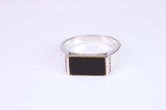 Gents Diamond and Black Onyx set Signet ring Set with natural earth mined Diamonds on the sides with a total weight of 0.08ct Ring is made from solid Silver with the top section made from solid Yellow Gold 925 graded Silver with 375 graded Yellow Gold Ring measures 8.20 mm wide and tapering down to 3.30 mm, the face measures 16 mm long x 8 mm wide British hallmarked Will come complete in gift box White Gold Studs, Signet Rings, White Band, Natural Earth, Gold Studs, Solid Yellow, Signet Ring, Yellow Gold Rings, Gold And Silver