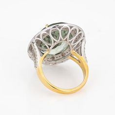 This is part of Chairish’s Fine Jewelry assortment.  Stylish prasiolite (green amethyst) & diamond cocktail ring crafted in 14 karat yellow gold & silver.   Faceted oval cut prasiolite measures 20mm x 15mm (estimated at 14 carats). Single cut diamonds total an estimated 0.38 carats (estimated at L-M color and I2-3 clarity). The prasiolite is in good condition and free of cracks or chips.    The minty green prasiolite is framed with purple enamel, a bright and lively combination of colors. The co Oval Green Amethyst Ring For Anniversary, Elegant Green Oval Amethyst Ring, Fine Jewelry Green Amethyst Oval Ring, Formal Gold Rings With Green Amethyst, Gold Rings With Green Amethyst For Formal Events, Gold Rings With Green Amethyst For Formal Occasions, Luxury Green Amethyst Gemstone Ring, Luxury Green Amethyst Ring, Luxury Yellow Gold Rings With Green Amethyst