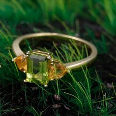 Transform Your Life with Our Three-Stone Heart Peridot & Citrine Ring Experience the powerful synergy of healing crystals with our exquisite Three-Stone Heart Peridot & Citrine Ring, crafted with care and intention. This beautiful piece is not just a ring; it's a source of emotional healing and positive energy. Specifications: Total Weight: 2.56g Stone Weight: 0.36g Silver Weight: 2.20g Main Stone Size: 5x7mm Shape/Pattern: Rectangle Setting Type: Prong Setting Metal Type: Yellow Gold and 925 St Rainbow Topaz, Diy Rings, Crystal Wand, Citrine Ring, Peridot Ring, 925 Silver Ring, 14k Gold Ring, Stone Heart, Delicate Rings