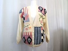 "Vtg 80s Patchwork Cottagecore Granny Cardigan Sweater Shoulder Pads Margules Ramie Blend Size S  Korea Vtg 80s Patchwork Cottagecore Granny Cardigan Sweater Shoulder Pads Margules Ramie Blend Relaxed Oversized 80s Size S Made in Korea Unique, funky, warm & cozy, rad, cool one of a kind cardigan sweater, relaxed fit with large shoulder pads!  C O N D I T I O N In good pre-loved, vintage condition. Ready to wear, no issues other than some regular wear, sold as is. Being an item over 35 years old, there may be natural signs of age or possible wear, but I have found no other issues. MEASUREMENTS: Shoulder to Shoulder: 21\" Bust: 20\" Pit to Pit: 20\" Waist: 19\" Hips: 14\" stretches to 20\" Length: 25\" Sleeve Length shoulder to wrist: 17\" V Neck top to 1st Button: 14\"" Granny Cardigan, Cardigan Cottagecore, Granny Sweater, Puff Sleeve Cardigan, Patchwork Cardigan, Black Chevron, Floral Cardigan, Green Cardigan, High Rise Mom Jeans